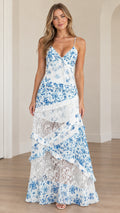 Front view of model wearing white and blue floral tiered lace spaghetti strap maxi dress