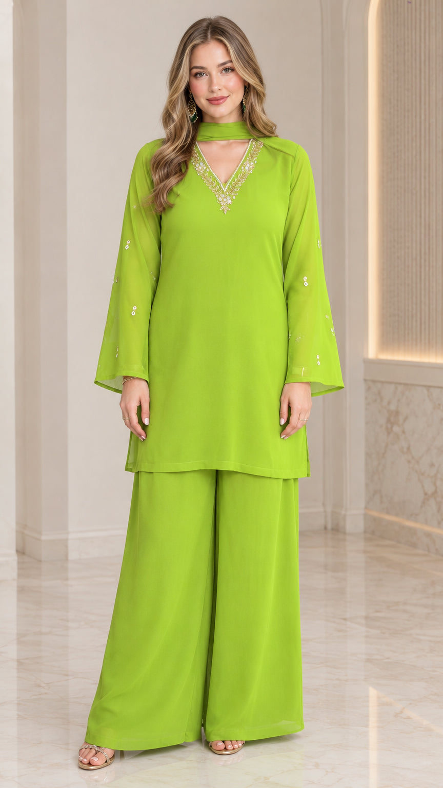 Front full-length view of model wearing lime green embellished tunic and wide-leg pant set