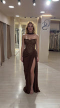 Full front view of model wearing brown strapless beaded corset maxi gown with high slit and neck scarf