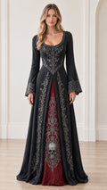 Front full-length view of woman wearing black gothic maxi dress with red skull embroidered panel and bell sleeves