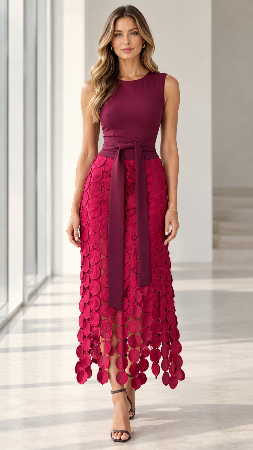 Model wearing Berry Red sleeveless midi dress with textured petal skirt and tie waist belt - front view