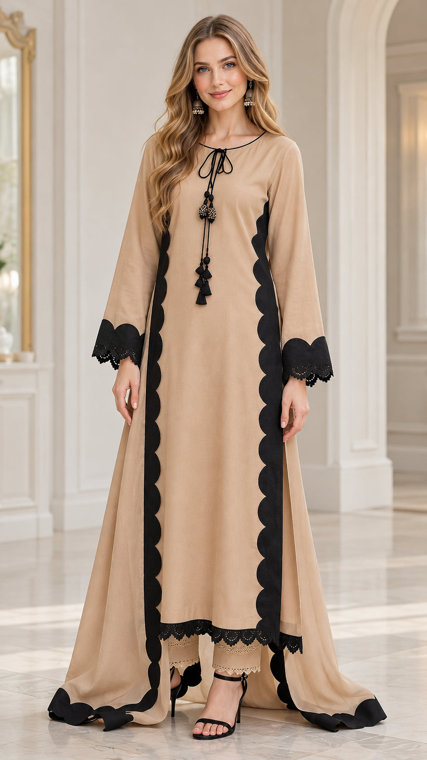 Front view of woman wearing beige high-low scallop trim tunic and trouser set