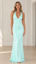 Front view of woman wearing mint green halter neck maxi evening gown