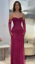 Front view of model wearing magenta strapless sweetheart glitter evening gown with detachable sleeves