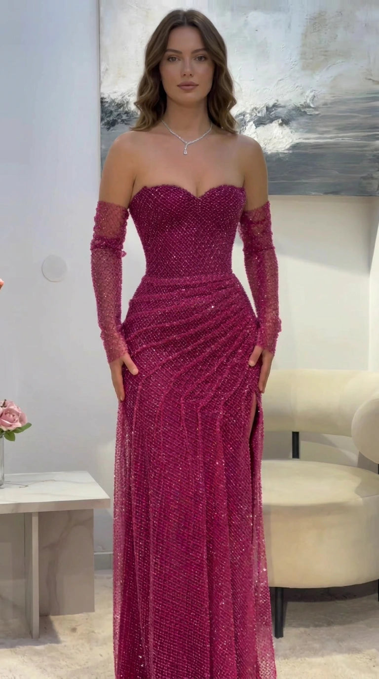 Front view of model wearing magenta strapless sweetheart glitter evening gown with detachable sleeves