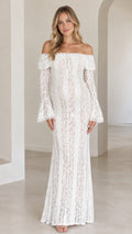 Front view of model wearing white off-the-shoulder floral lace maxi gown with bell sleeves