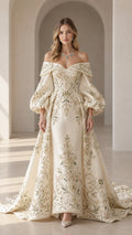 Front full-length view of an ivory off-the-shoulder evening gown with balloon sleeves and floral embroidery