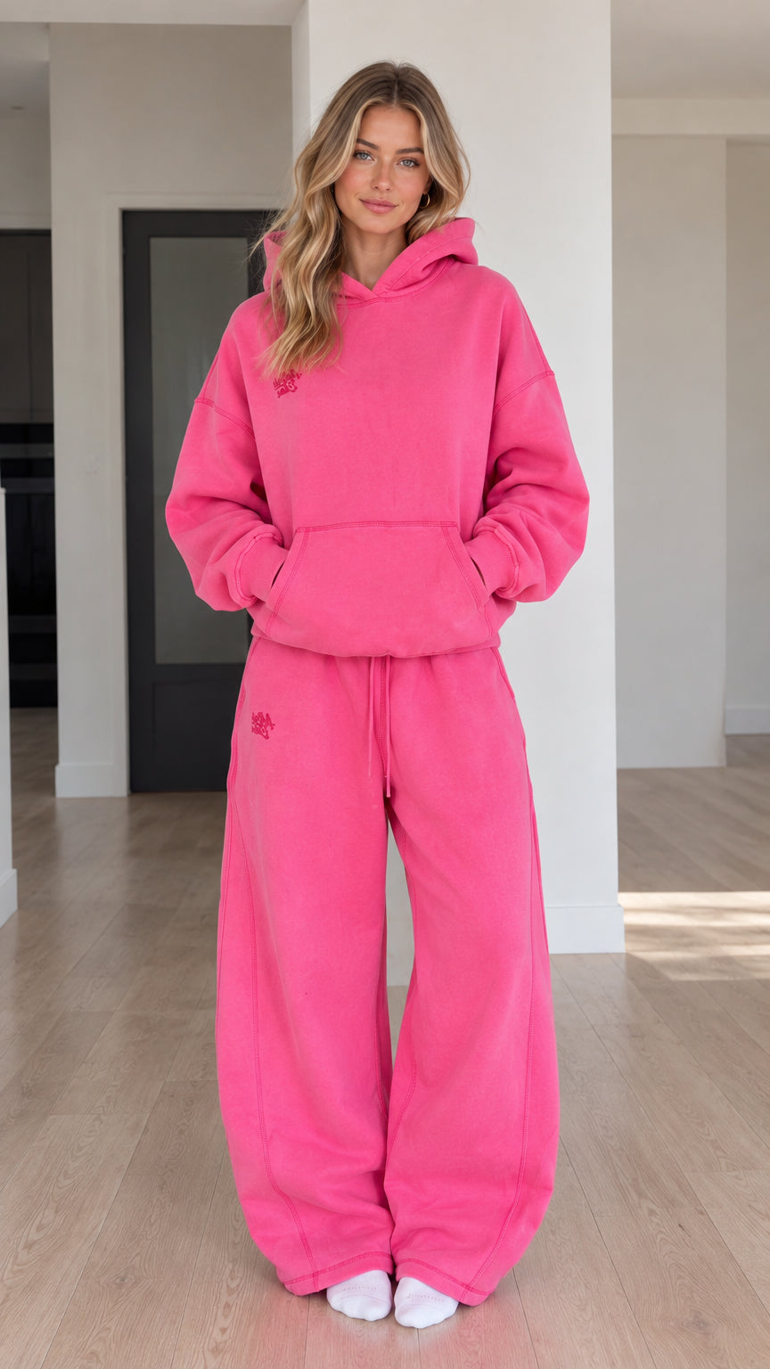 Full front view of model wearing Fuchsia oversized hoodie and wide-leg sweatpants set