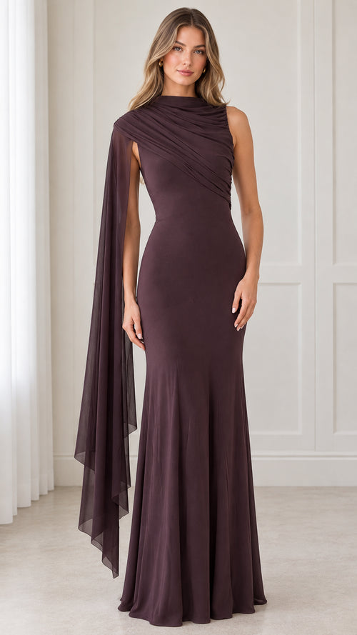 Front view of model wearing a plum high neck evening maxi dress with flowing asymmetric cape drape