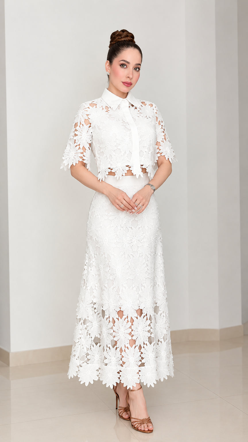 Full front view of model wearing white floral lace collared top and maxi skirt set