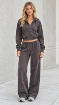 Full front view of model wearing washed charcoal cropped zip hoodie and wide leg sweatpants