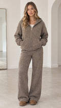 Front full-length view of model wearing taupe textured knit zip hoodie and wide-leg lounge pants set