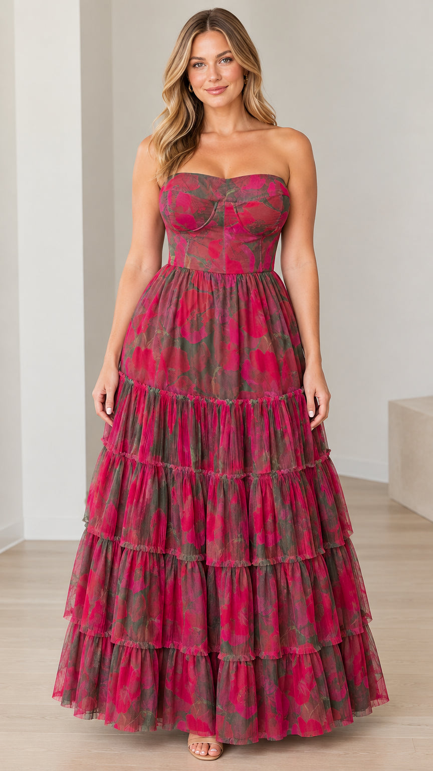 Front view of model wearing magenta floral strapless bustier tiered maxi dress