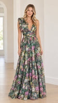 Full front view of model wearing green floral deep V-neck maxi gown with ruffle shoulder