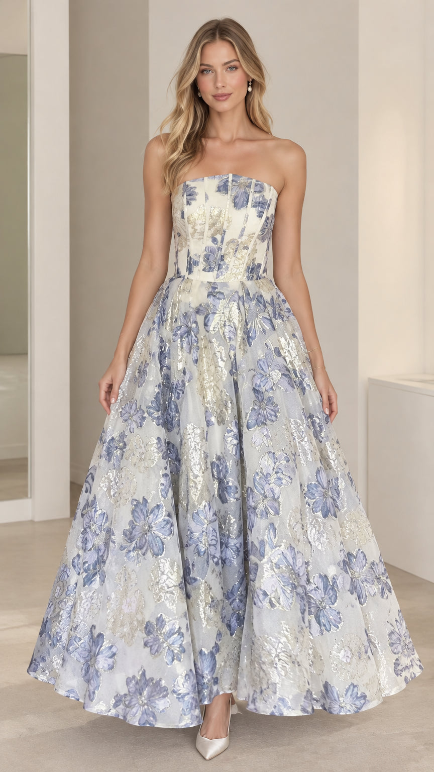 Front view of model wearing a light blue strapless floral jacquard ballgown