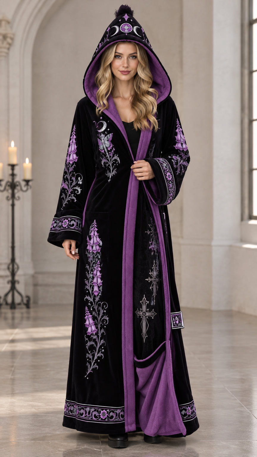 Black celestial embroidered hooded velvet robe with purple contrast lining on model front view