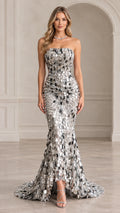 Front view of woman wearing silver strapless mirrored sequin mermaid evening gown