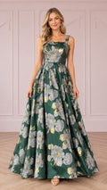 Front view of woman wearing emerald green floral jacquard sleeveless A-line evening gown