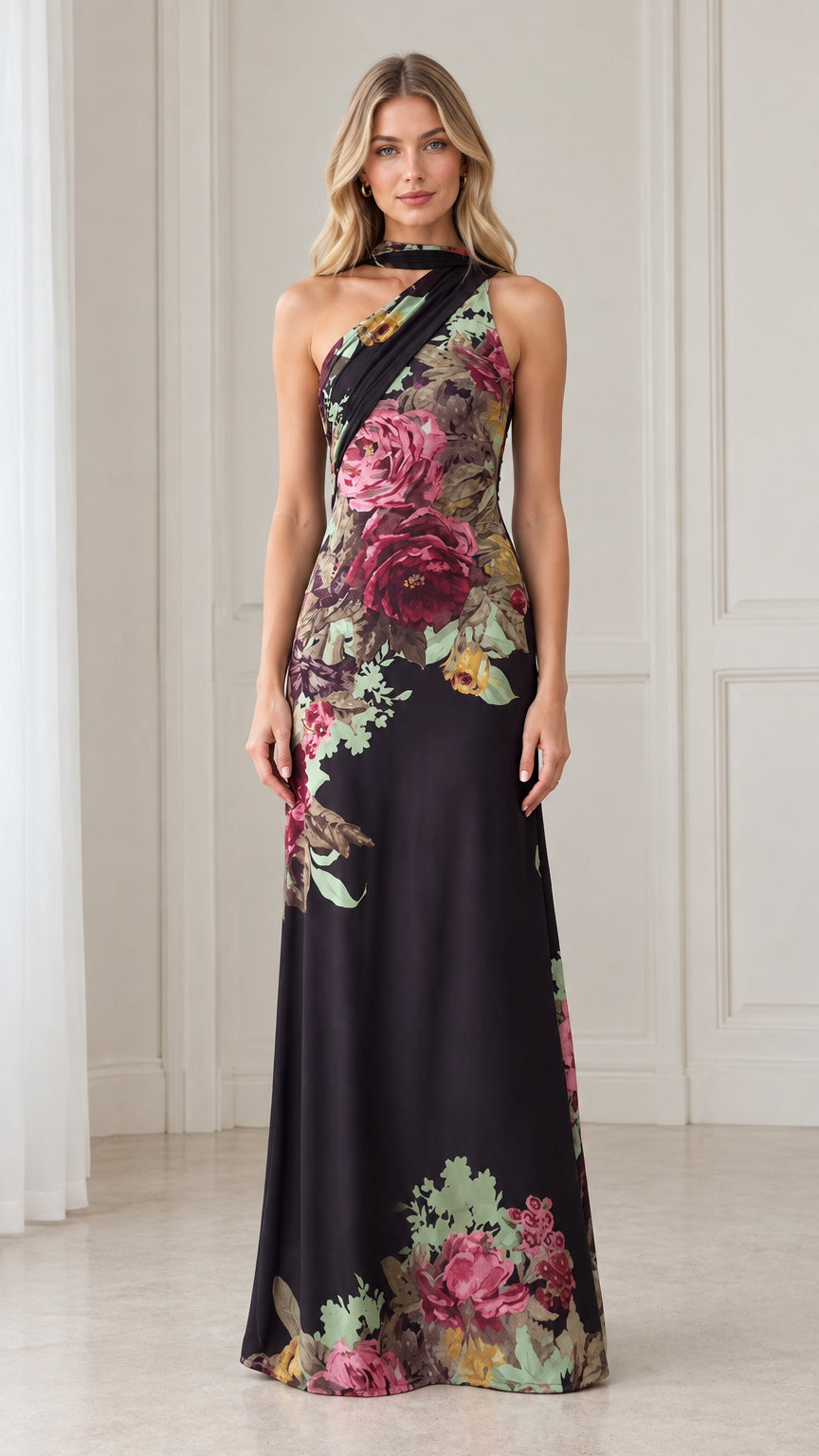 Front view of model wearing black floral print asymmetric choker neck maxi dress