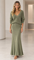 Front full view of woman wearing sage green ribbed V-neck sweater and maxi skirt set