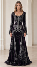 Front full view of deep plum velvet maxi dress with skeleton bone print and lace neckline