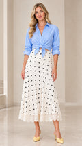 Full front view of blue striped tie-front shirt and white polka dot midi skirt with lace hem