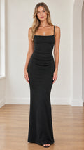 Front view of model wearing black square neck ruched maxi evening dress