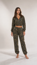 Front full view of woman wearing olive green camouflage cropped hoodie and jogger set