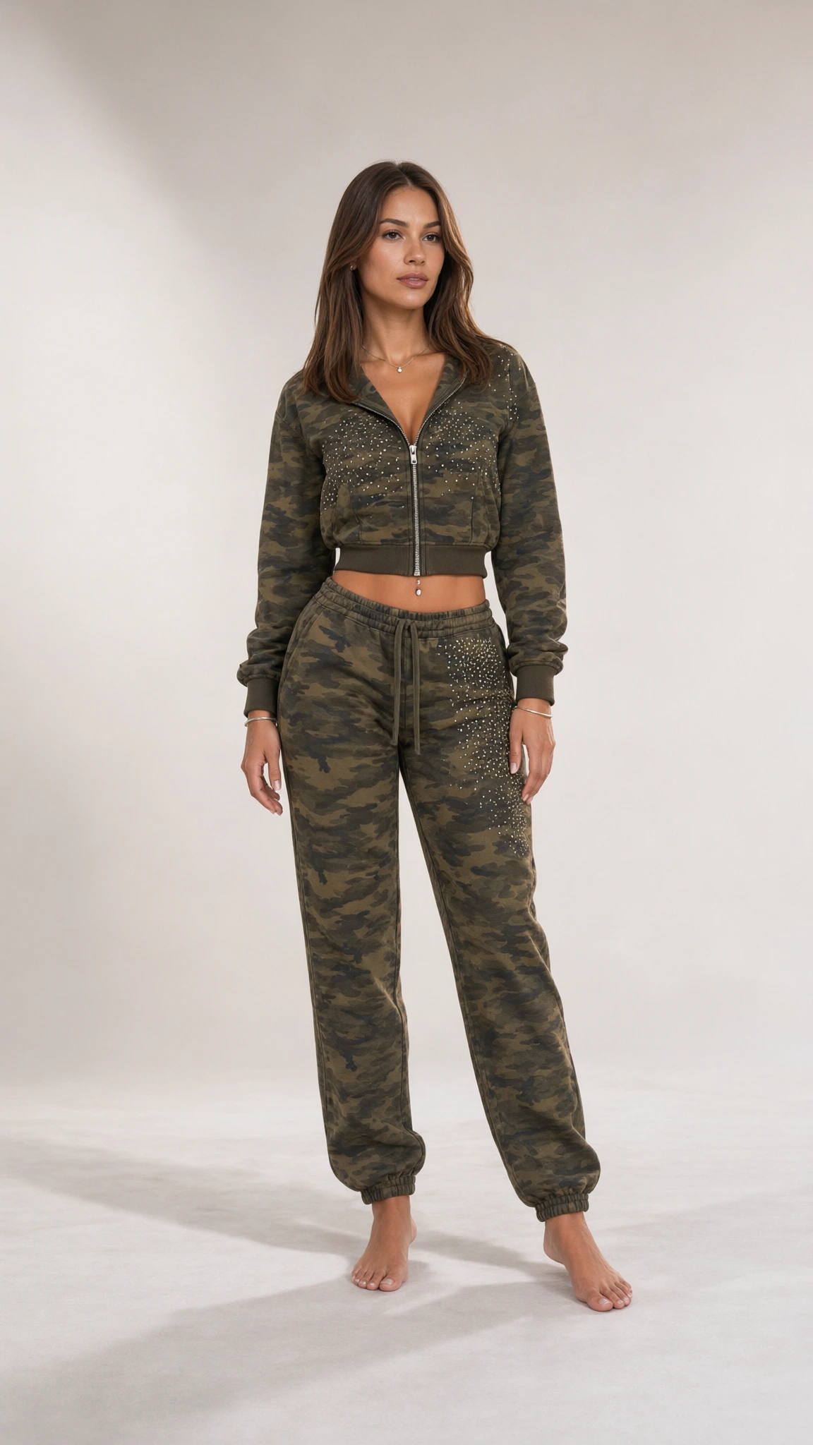 Front full view of woman wearing olive green camouflage cropped hoodie and jogger set