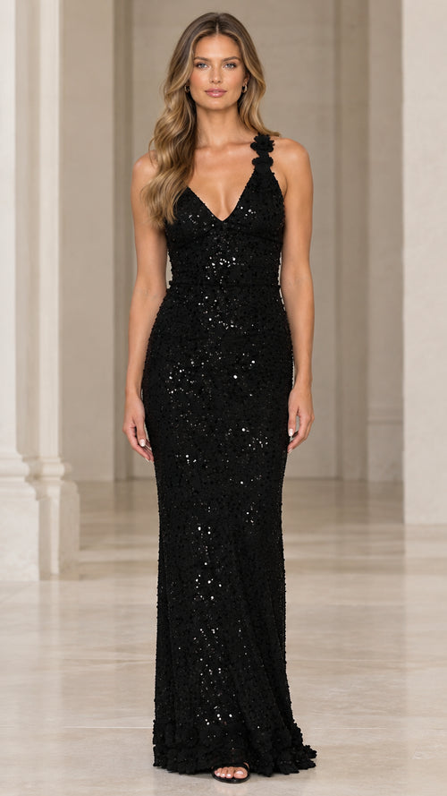 Front view of black sequin V-neck evening gown on model