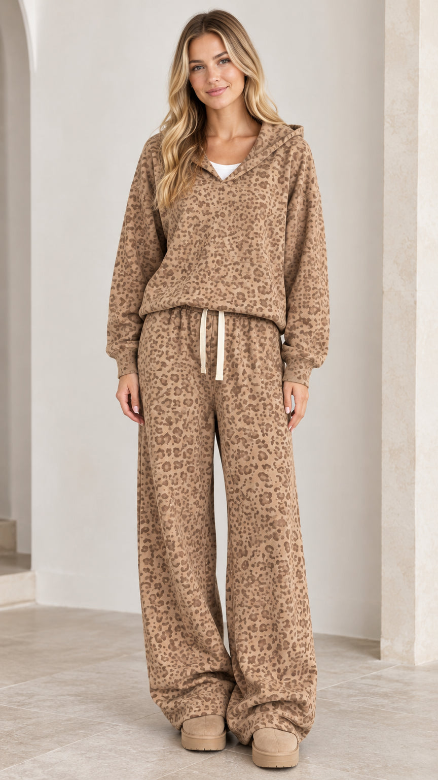 Front view of model wearing camel leopard print hooded sweatshirt and wide-leg lounge pants set