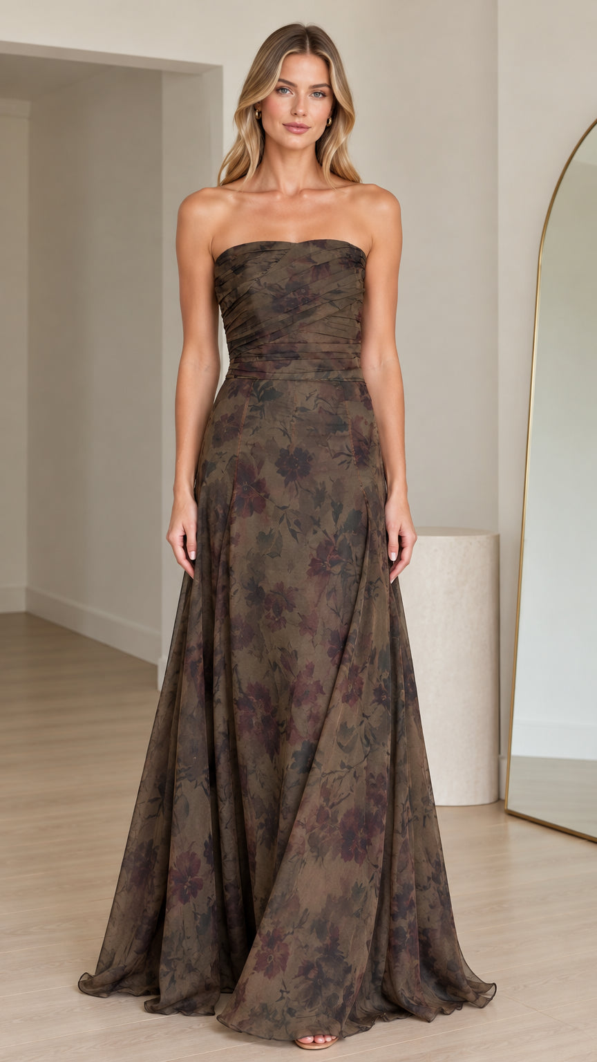 Front view of woman wearing strapless olive floral maxi gown