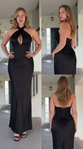 Front, side, and back view of woman wearing black cross halter top and lace-up maxi skirt set