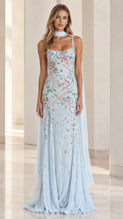 Front view of model wearing a light blue floral beaded scoop-neck evening gown with matching neck scarf