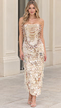 Model wearing cream strapless column midi dress with seashell and pearl embellishments front view
