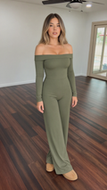Model wearing sage green off-the-shoulder long sleeve wide-leg jumpsuit front view