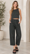 Full front view of model wearing dark green plaid sleeveless crop top and wide-leg cropped pants set