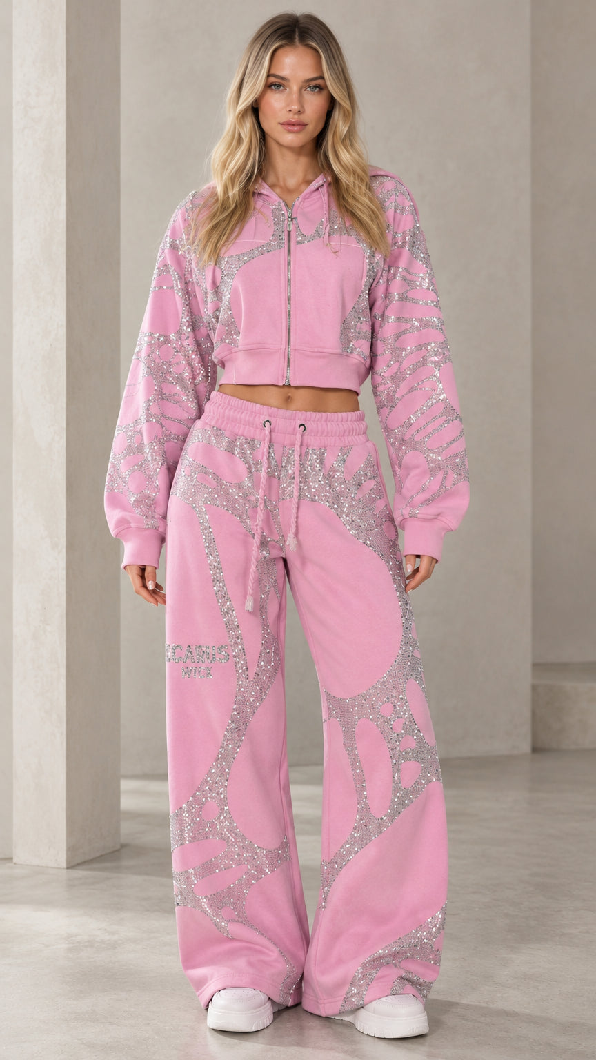 Front view of model wearing pink rhinestone web cropped hoodie and wide-leg sweatpants set