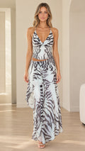 Model wearing light blue zebra print halter top and draped maxi skirt set front view