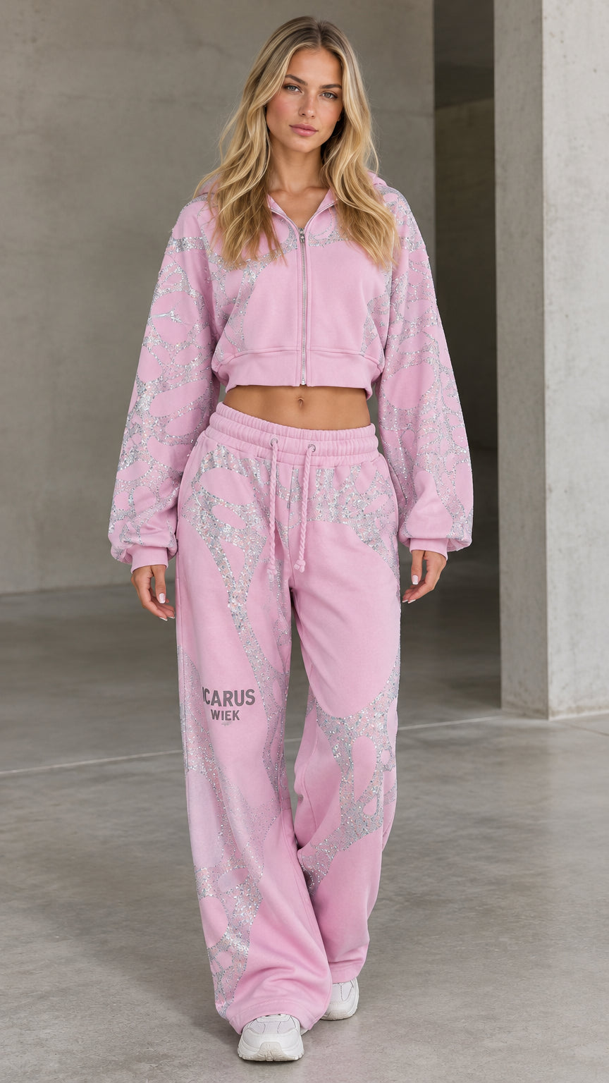 Front full view of woman wearing pink rhinestone cropped hoodie and wide-leg sweatpants set