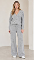 Front full view of woman wearing grey knit cardigan and wide leg lounge pants set
