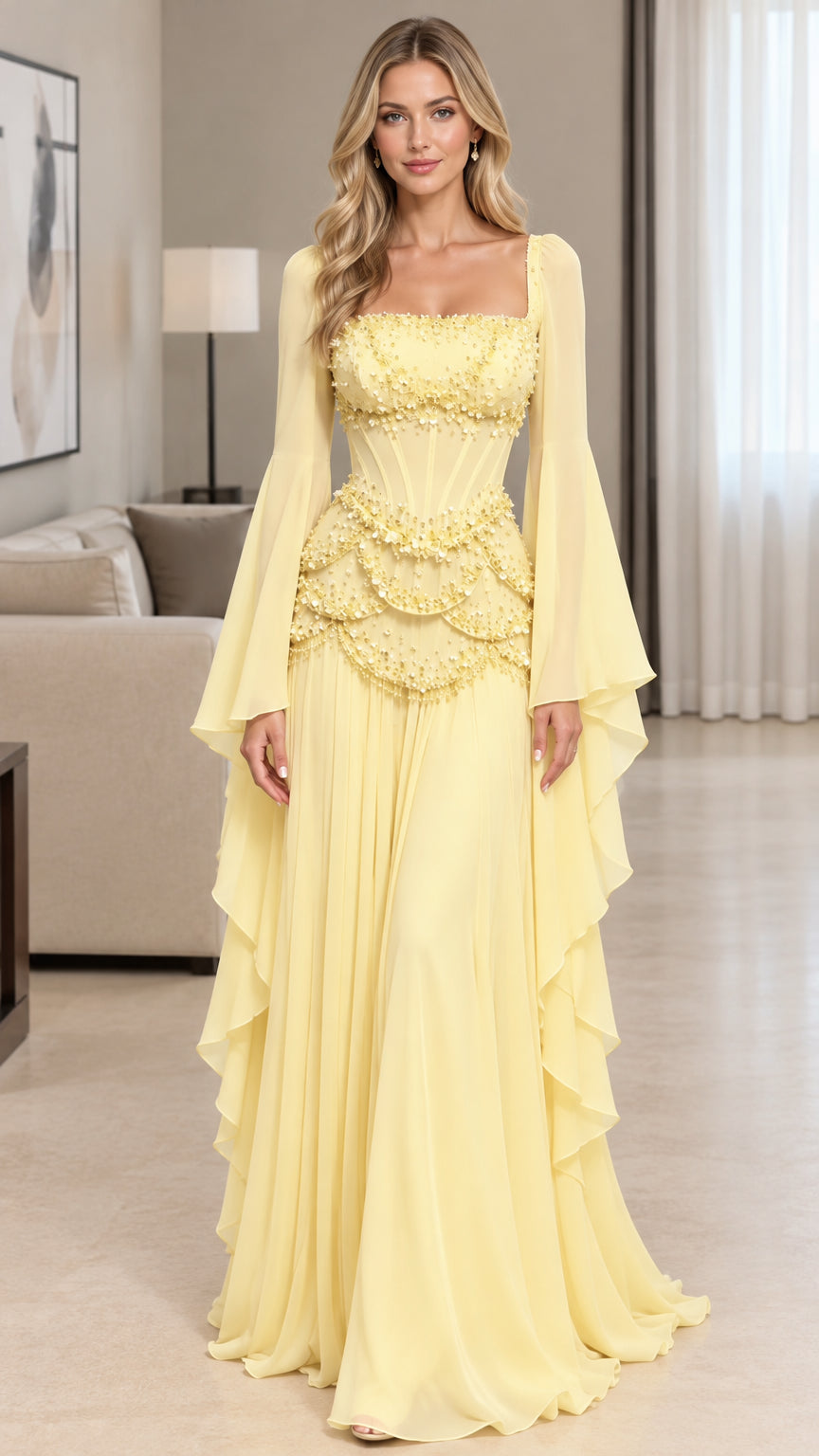 Front full-length view of model wearing pastel yellow square neck beaded corset evening gown with bell sleeves
