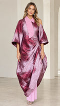 Full front view of model wearing fuchsia pink metallic draped asymmetrical kaftan and matching pants set