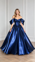 Front view of model wearing royal navy blue off-the-shoulder satin ballgown with puff sleeves