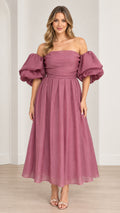 Front view of model wearing off-the-shoulder puff sleeve pleated midi dress in mauve