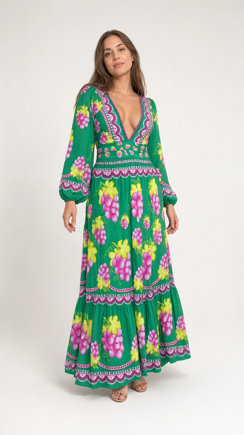 Front full view of woman wearing green vintage grape print plunge maxi dress