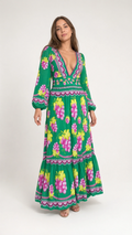 Front full view of woman wearing green vintage grape print plunge maxi dress