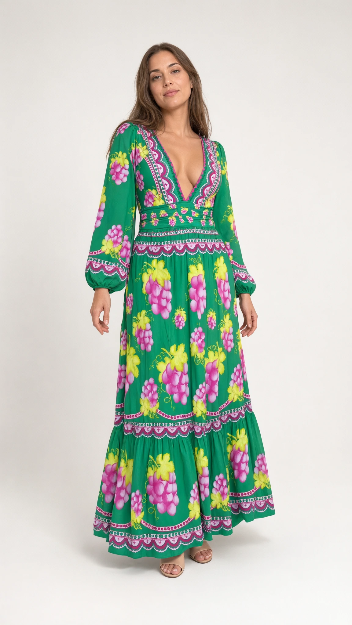 Front full view of woman wearing green vintage grape print plunge maxi dress