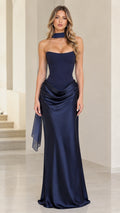 Front view of woman wearing navy blue strapless satin maxi evening gown with matching neck scarf