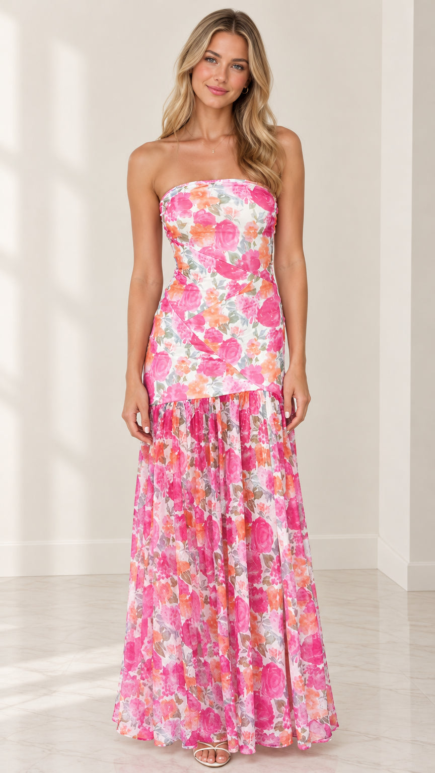 Front full-length view of model wearing strapless pink floral tiered maxi dress